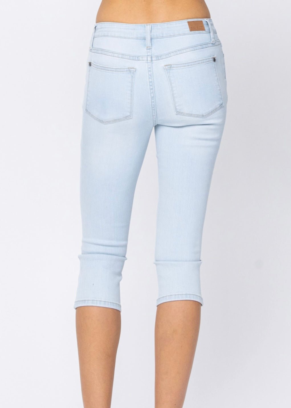 https://www.jimberlys.com/cdn/shop/products/judy-blue-kelly-mid-rise-capri-jeans-663783.jpg?v=1687623611&width=1021